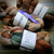 Malabrigo Nube in Corteza, 100% Merino wool roving skeins in earthy tones of brown, green, and beige, 4oz each, for spinning and felting.