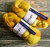 Malabrigo Nube Frank Ochre Merino Wool Roving, 4oz, yellow-orange merino wool spinning and felting fiber in a soft skein.