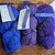 Malabrigo Worsted Violetas purple hand-dyed merino wool skeins, varying shades of blue and purple, labeled "030 Purple Myster" and "Violetas".