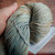 Malabrigo Rios Magnolia 263 Neutral Worsted Merino Yarn skein in a soft, creamy gray-beige color with subtle warm undertones.