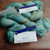 Malabrigo Rios RIO-264 Celestina Superwash Merino Worsted Yarn, green blue yarn skeins with white and blue labels, worsted yarn in soft pastel hues.