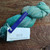 Malabrigo Rios yarn, Celestina, Superwash Merino Worsted, turquoise green skein with white label and blue tag, RIO-264.