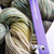 Malabrigo Rios yarn in Gardenia color, Superwash Merino Worsted yarn skein with label RIO-268, showcasing soft green, beige, and white hues.