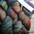 Malabrigo Rios Pocion yarn, Jewel-Tone Worsted Merino, multicolored skeins in blue, green, red, and yellow hues, labeled 139.