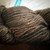 Malabrigo Rios Coco Tonal Espresso Superwash Merino Yarn, brown and black variegated skein, soft and chunky texture, earthy tone color.