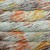 Malabrigo Rios Siri yarn, Superwash Merino, in Speckled Gray & Rust, showcasing soft gray base with vibrant orange, yellow, and brown speckles, neatly wrapped in skeins, highlighting the yarn's texture and color pattern. Malabrigo Rios Siri yarn, Superwash Merino, in Speckled Gray & Rust, showcasing soft gray base with vibrant orange, yellow, and brown speckles, neatly wrapped in skeins, highlighting the yarn's texture and color pattern.