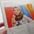 Malabrigo Pattern Book 7: Rasta In Brooklyn, featuring a woman modeling colorful scarf and pattern details on a page.