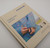 Malabrigo Timeless Knits pattern book lying on a white table.