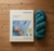 Malabrigo Timeless Knits pattern book lying on a table with a skein of yarn beside.