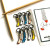 Artisan enamel sock stitch markers styled with knitting notions and project bag accessories.
