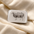 Cuts of Lamb Notions Tin, rectangular white tin with detailed diagram of lamb cuts, displayed on cream-colored fabric background, ideal for sewing notions.