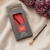 Lantern Moon Ebony Repair Hook, 3.25mm, luxury crochet hook for dropped stitches, featuring ebony handle and wooden tip, in packaging and beside yarn.