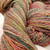 The Rogue Dye Lot Studio Variant HS-866B handspun sport DK merino wool yarn skein multi-colored with shades of pink, green, yellow, and blue.