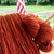 Bittersweet Bulky Handspun superwash Merino Yarn in a rich, dark orange color, displayed in a skein with a rustic, textured appearance.