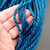 Handspun Bulky Merino Yarn in Freedom Tonal Blue, thick, vibrant blue yarn held in hand, showcasing its texture and color.