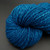 Handspun Bulky Merino Yarn in Freedom Tonal Blue, a vibrant blue skein with subtle tonal variations, showcasing its texture and color.