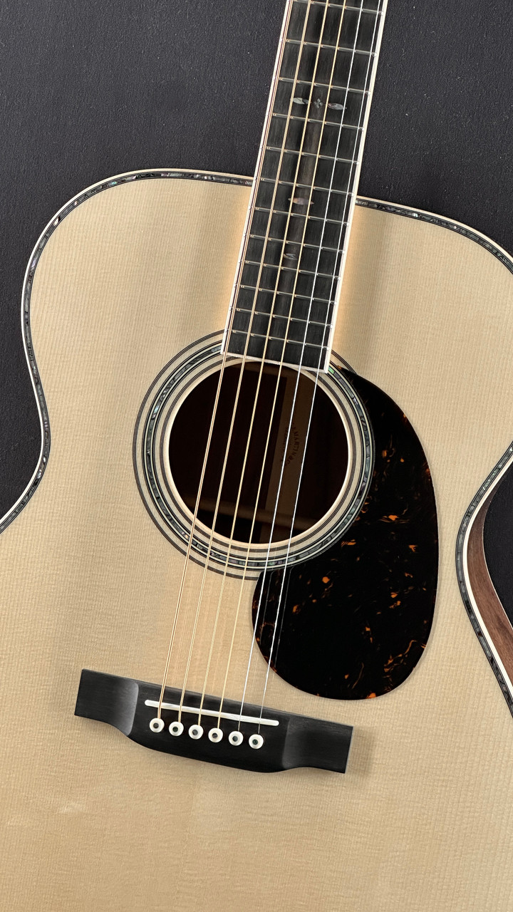 Martin Custom Shop 000 in Figured Black Walnut with Italian Alpine Spruce Top Angle