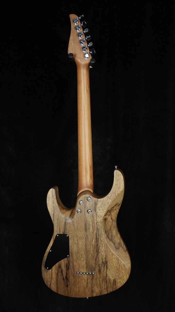 Suhr Custom Modern in Transparent Amber with Black Limba Body