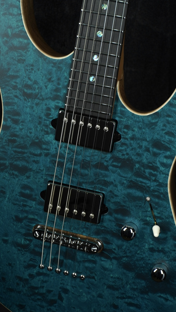 Suhr Custom Modern in Transparent Teal with Black Limba Body