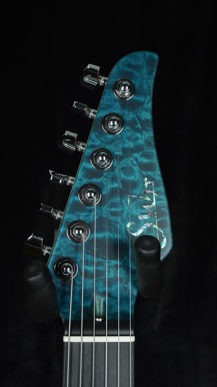 Suhr Custom Modern in Transparent Teal with Black Limba Body