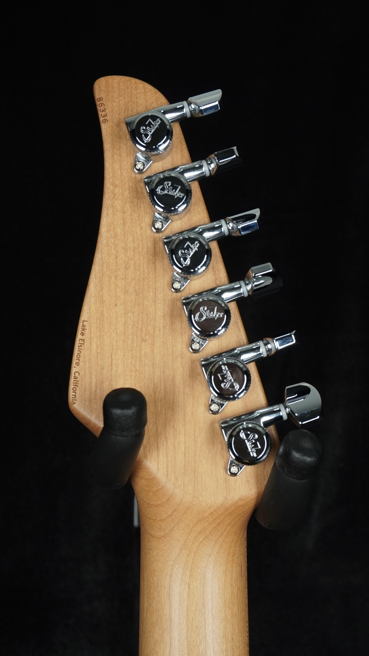 Suhr Custom Modern in Transparent Teal with Black Limba Body