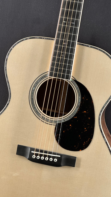 Martin Custom Shop 000 in Figured Black Walnut with Italian Alpine Spruce Top Angle
