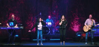 a group of people on a stage