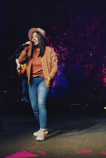 a person singing into a microphone