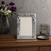 Silver plated 4 x 6 photo frame with decorative birds and floral border by Sixtrees Higgins
