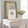 Antonia cast metal 5 x 7 inch photo frame featuring floral detailing, sparkling crystal-style accents and soft pearl-effect teardrop embellishments.