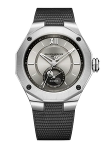 Baume & Mercier Riviera 10681 Baumatic front view — 43 mm steel case, beige sable sun-satin dial with moon-phase at 6 o’clock, grey rubber strap.