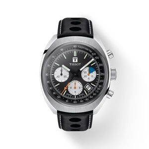 Front view of the Tissot Heritage 1973 T124.427.16.051.00 with black reverse-panda dial, matte white counters and black rally strap.