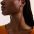 Model wearing Spear hoop earring 40 MM in silver and diamonds EBP9012472DI Model wearing Spear hoop earring 40 MM in silver and diamonds EBP9012472DI