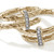 Close-up of pavé diamond setting on gold Spear hoop earring Close-up of pavé diamond setting on gold Spear hoop earring