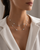 Diamond station necklaces layered