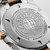 Longines HydroConquest L3.769.3.58.7 Swiss Made 42mm quartz dive watch with black sandblasted dial, black unidirectional rotating bezel, and stainless steel with red PVD-coated bracelet.