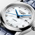 Longines Master Collection L2.449.4.87.2 30mm automatic watch with white mother-of-pearl dial, diamond hour markers and blue alligator leather strap.