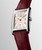 Longines DolceVita L5.512.4.28.2 Swiss Made quartz watch with pink ivory flinqué dial, rose-gold-coloured Roman numerals, rectangular stainless steel case, and maple red alligator leather strap.