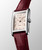 Longines DolceVita L5.255.4.28.2 Swiss Made quartz watch with an ivory rose flinqué dial, painted Roman numerals, blued steel hands, rectangular stainless steel case, and maple red alligator leather strap.