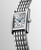 Longines Mini DolceVita L5.200.4.87.6 Swiss Made quartz watch featuring a snow-set white mother-of-pearl dial with diamonds, rectangular stainless steel case, and stainless steel bracelet.
