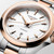 Longines Conquest L3.350.3.18.7 Swiss Made 30 mm quartz watch with a white sandblasted dial, stainless steel case with rose gold PVD bezel, and stainless steel bracelet with rose gold PVD centre links.