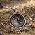 Pyrrha Wave Talisman N723-18 sterling silver necklace with an 18-inch chain and intricate wave design.