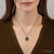 Pyrrha Wave Talisman N723-18 sterling silver necklace with an 18-inch chain and intricate wave design.