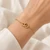 10K Yellow Gold Interlocking Double-Loop Bracelet 9 × 14 mm [B050A]