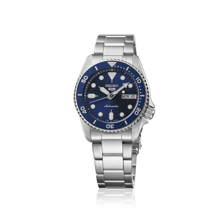 Seiko 5 Sports SKX SRPL77 38mm automatic watch with navy blue dial, blue unidirectional rotating bezel, stainless steel case and stainless steel bracelet.
