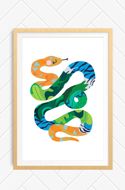 Design and printed in Australia, this digital illustration features a long snake python twisting itself on the page. It is brightly coloured with blue and green patterns, with a orange and blue head and tail. The artwork is framed in a oak wooden frame.