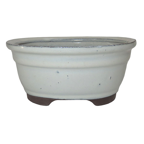 a white bowl with black legs