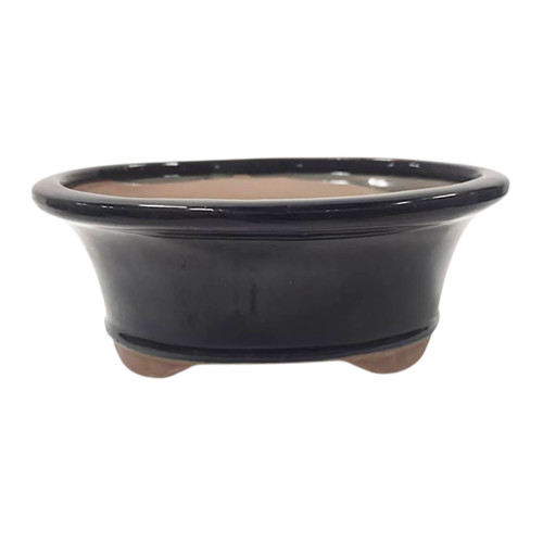 a black bowl with brown liquid