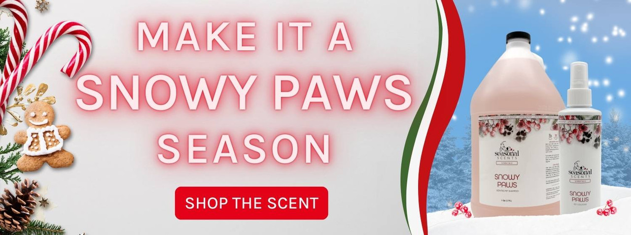 Holiday banner showcasing Snowy Paws Pet Shampoo and Cologne against an outdoor wintery backdrop. Text reads 'Make It A Snowy Paws Season'. A red button below reads 'Shop The Scent'.