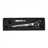 Monk Black 9.5" Curved Shear in a protective black foam-lined case with gel finger ring and shear oil